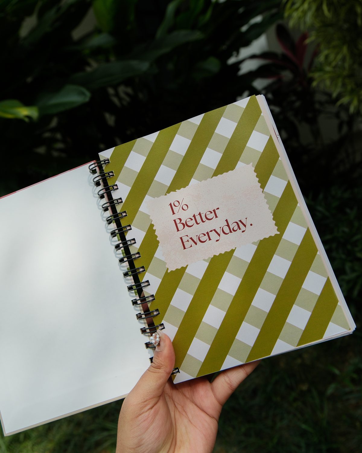 The 90-Day Daily Planner in the grass